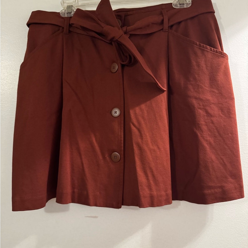 Women's ponte Mini Skirt with Button Detail - Rust colored.